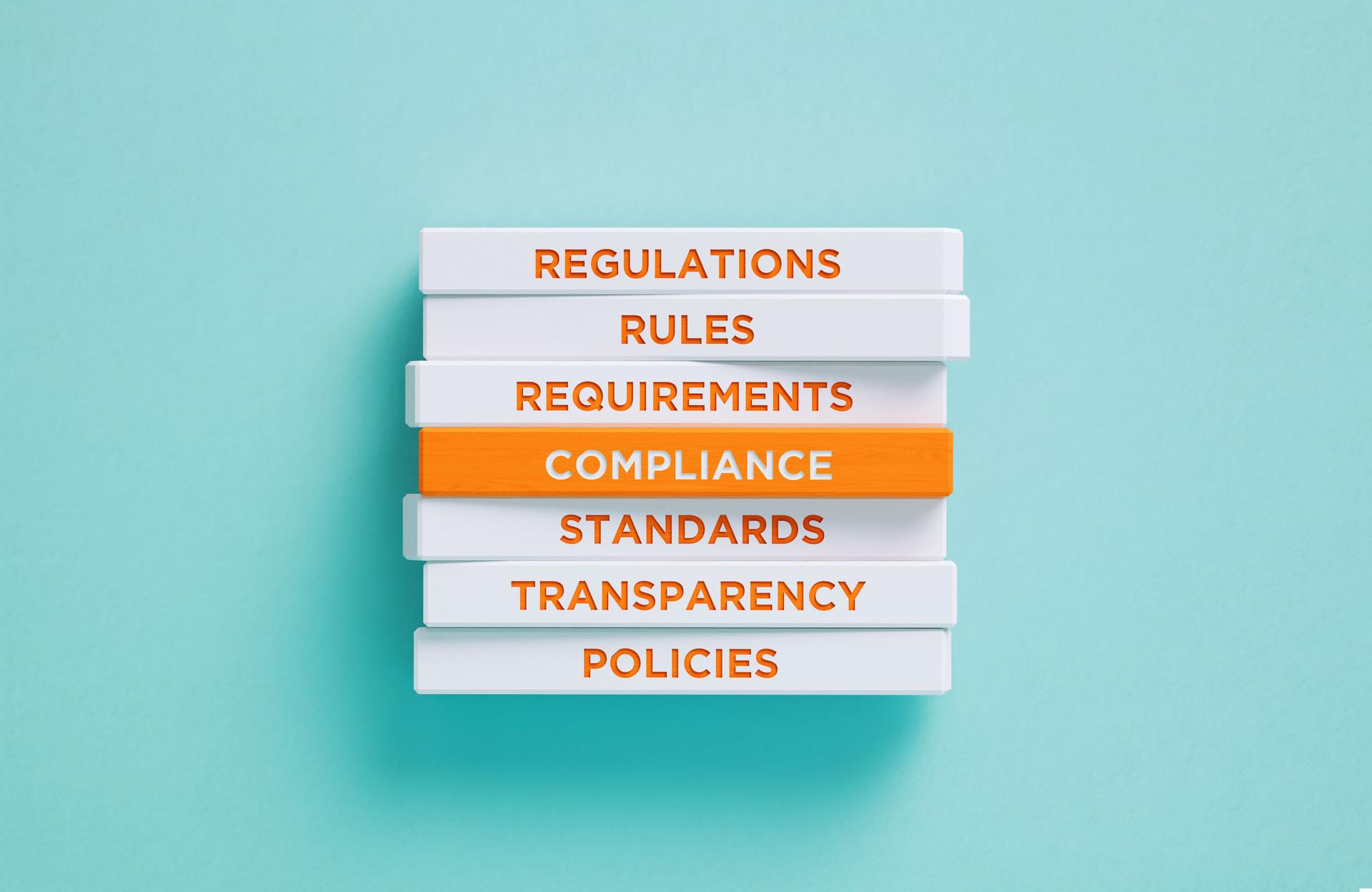 Compliance Related Words Written Wood Blocks On Blue Background - Compliance Concept